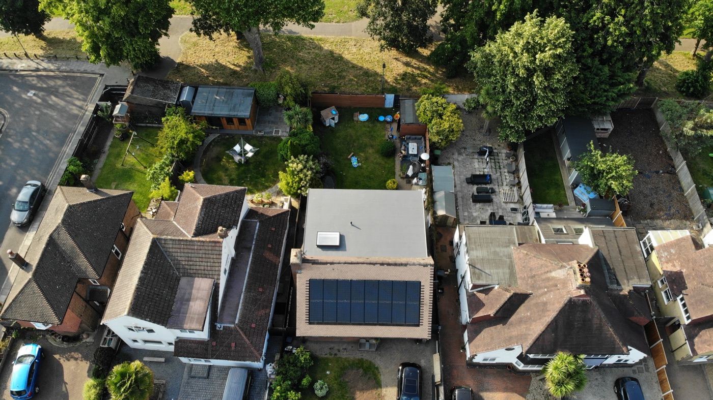 Aerial view of flat-roof extension with solar panels