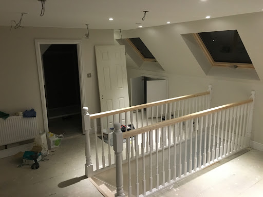 New loft conversion staircase and landing with Velux windows